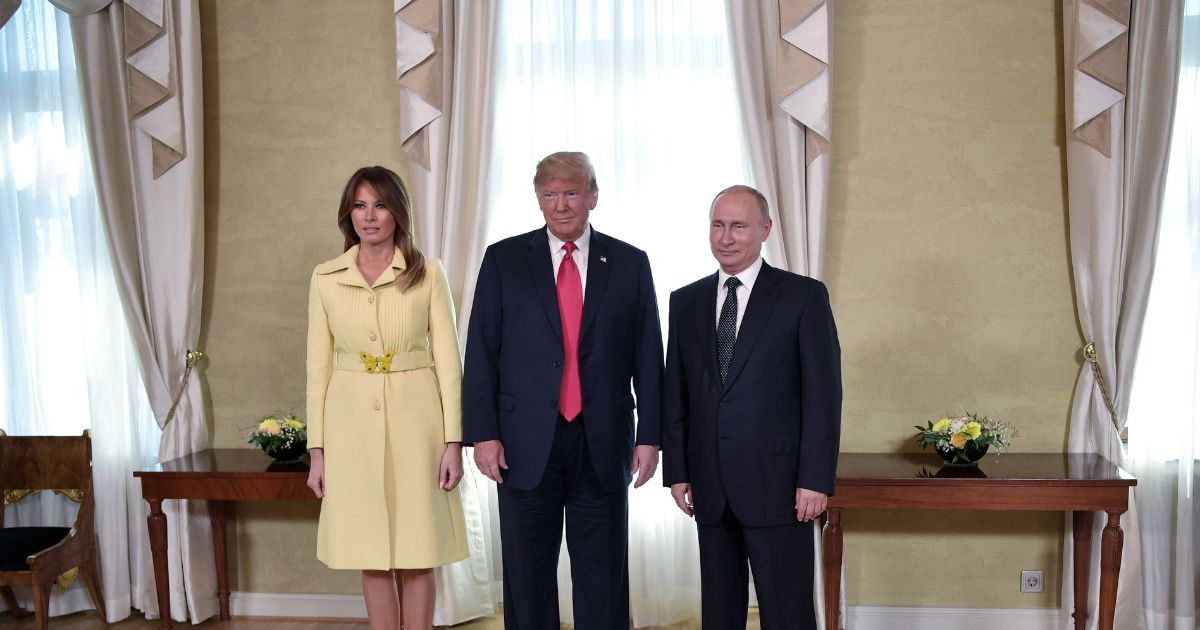 President Donald Trump, Russian President Vladimir Putin, and First Lady Melania Trump pose ahead of a meeting in Helsinki, Finland, on July 16, 2018.