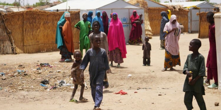 Women and children displaced by Boko haram attacks are seen outside a camp in Dikwa, north east Nigeria, April 29.