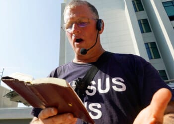 Dr. Coleman Boyd reads from the Bible as he stands outside the Jackson Women's Health Organization clinic in Jackson, Mississippi, on June 29, 2022.