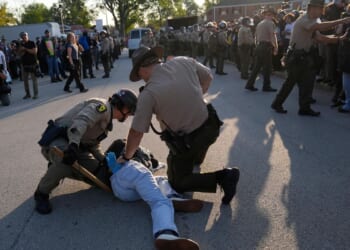 Kristi Noem visits Chicago area ICE facility as agents arrest 13, raid city neighborhoods