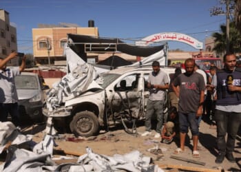 A journalist reports from the scene of an Israeli strike that hit a tent used by displaced Palestinians inside the vicinty of the Shuhada al-Aqsa Hospital in Deir al-Balah in the central Gaza Strip on Oct. 1, 2025.