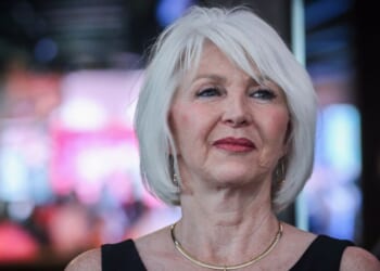 Former Mesa County Clerk Tina Peters reacts to early election returns during a primary night watch party at the Wide Open Saloon on June 28, 2022, in Sedalia, Colorado.