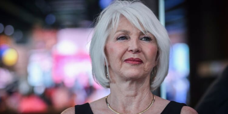 Former Mesa County Clerk Tina Peters reacts to early election returns during a primary night watch party at the Wide Open Saloon on June 28, 2022, in Sedalia, Colorado.