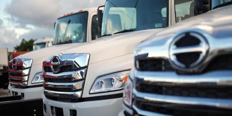 Trump signs order imposing tariffs on heavy trucks, buses and parts