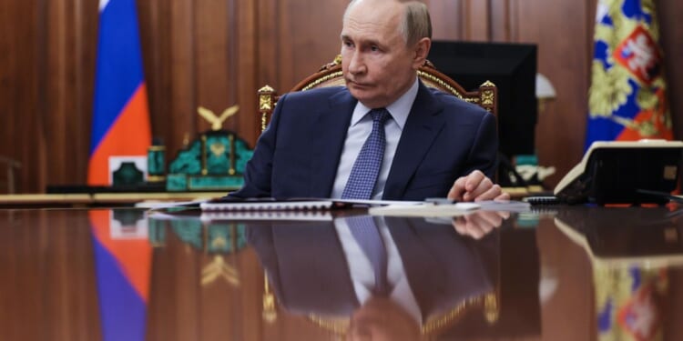 Vladimir Putin directs drills of Russian nuclear forces as his summit with Trump is put on hold