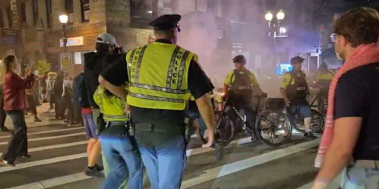 Boston police confront pro-Palestinian protesters Tuesday on the anniversary of the Oct. 7, 2023 massacre in Israel.