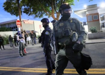 Federal agents, including those with the Department of Homeland Security and the Border Patrol, square off against antifa demonstrators Friday in Portland, Oregon.