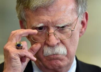 Then-national security adviser John Bolton answers journalists questions after a meeting with Belarus President in Minsk on Aug. 29, 2019.