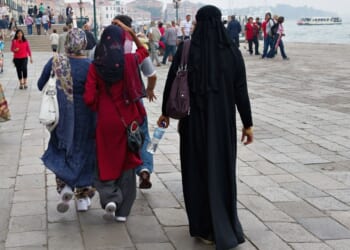 Women wearing veils and burquas walk in Venice, Italy, in a file photo from June 1, 2011.