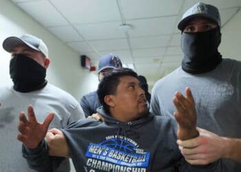 A man is detained by ICE agents after leaving a court hearing in immigration court at the Jacob K. Javitz Federal Building in New York City on Aug. 26.