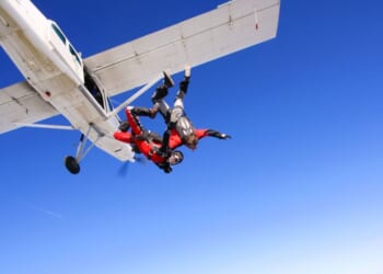 Parachuters jumping from a plane.