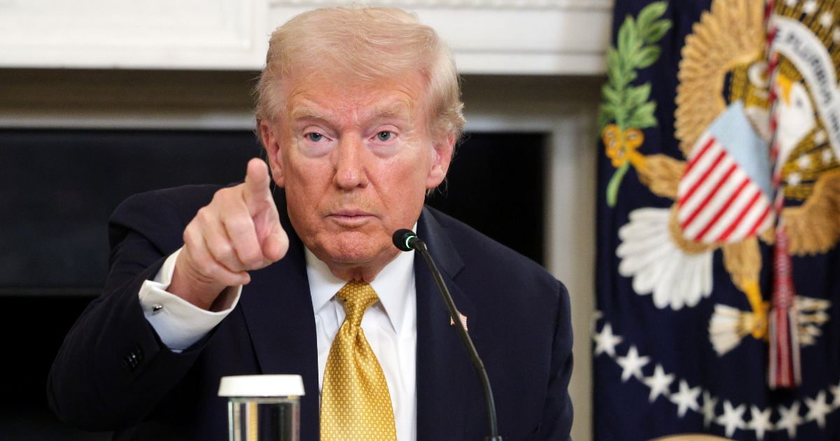 U.S. President Donald Trump points to a reporter in the State Dining Room of the White House on Oct. 23, 2025, in Washington, DC.