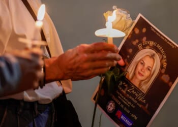 Attendees hold candles at a vigil for Iryna Zarutska in Charlotte, North Carolina, on Sept. 22, 2025.