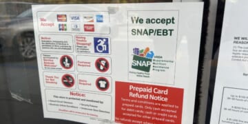 A sign advertising "We Accept SNAP and EBT" posted outside a store in Lafayette, California, on Nov. 4, 2025.