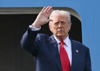 President Donald Trump waves as he boards Air Force One after talks with Chinese President Xi Jinping at the Gimhae Air Base, located next to the Gimhae International Airport in Busan on Oct. 30, 2025.