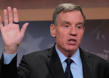 Sen. Mark Warner, a Democrat from Virginia, talks to reporters about Democrats being excluded from briefings the Trump administration gave to Republicans about military strikes on alleged drug boats at the U.S. Capitol on Oct. 30, 2025, in Washington, D.C.