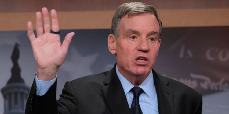 Sen. Mark Warner, a Democrat from Virginia, talks to reporters about Democrats being excluded from briefings the Trump administration gave to Republicans about military strikes on alleged drug boats at the U.S. Capitol on Oct. 30, 2025, in Washington, D.C.