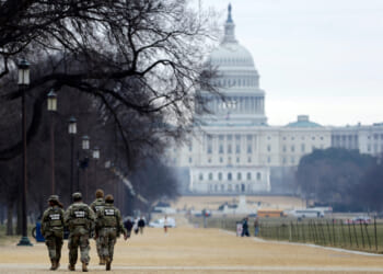 National Guard patrol the Washington Mall, with the U.S. Capitol in the background, on Jan. 9, 2026, in Washington, D.C.