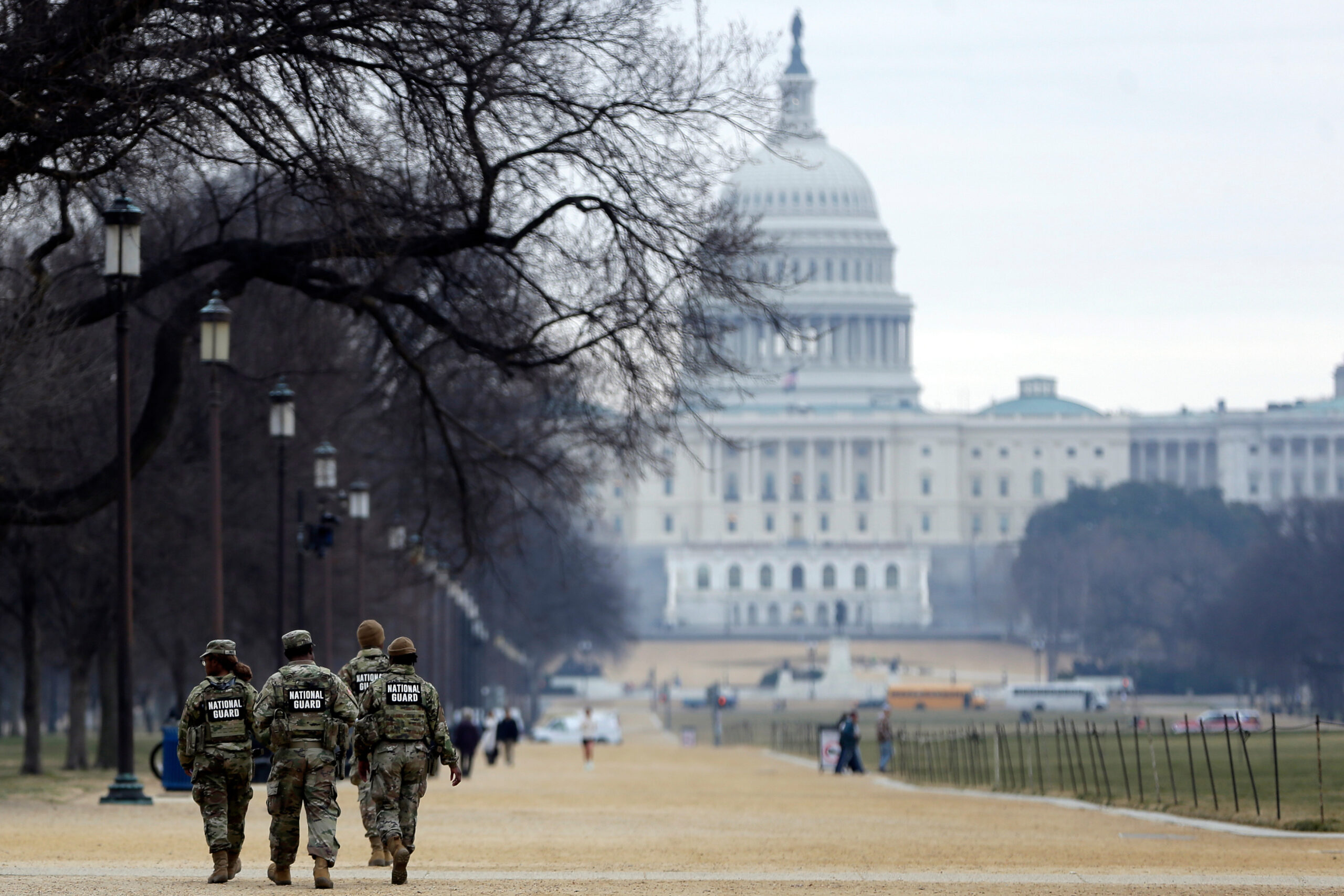 National Guard patrol the Washington Mall, with the U.S. Capitol in the background, on Jan. 9, 2026, in Washington, D.C.