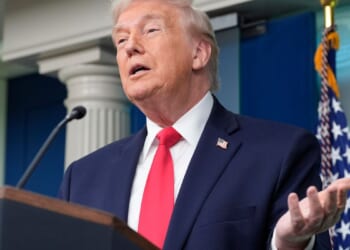 Trump boasts about his year-one record in surprise visit to White House briefing