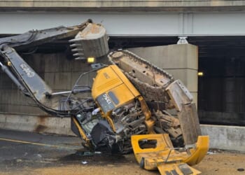 Excavator machine falls off transport truck on I-395 in D.C., leading to hazmat response