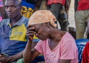 Survivors of Sunday's attack in Kurmin Wali, northwest Nigeria, react during a meeting with Kaduna state Governor Uba Sani Wednesday.