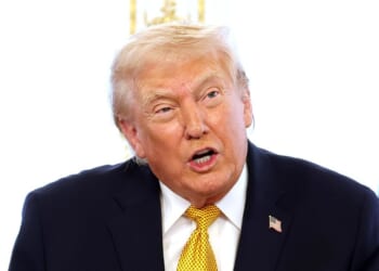 President Donald Trump calls service members on Christmas Eve at the Mar-a-Lago resort on Dec. 24, 2025, in Palm Beach, Florida.