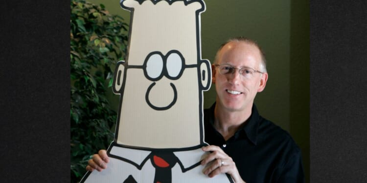 Scott Adams, creator of the comic strip"Dilbert," is seen in a file photo dated Oct. 26, 2006, posing for a portrait with the Dilbert character in his studio in Dublin, California. Adams has died of prostate cancer at age 68.