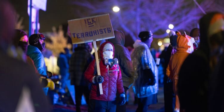 Anti-ICE protesters and agitators gather outside a federal building in Minneapolis, Minnesota, on Jan. 17, 2026.