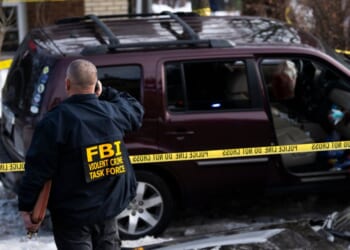 Members of law enforcement work the scene following a suspected shooting by an ICE agent during federal law enforcement operations on Jan. 7, 2026, in Minneapolis, Minnesota.