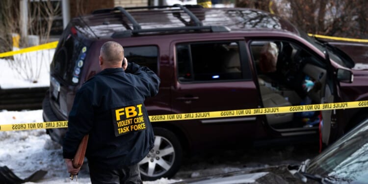 Members of law enforcement work the scene following a suspected shooting by an ICE agent during federal law enforcement operations on Jan. 7, 2026, in Minneapolis, Minnesota.