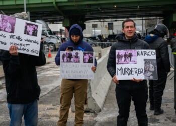 A few protestors hold signs in favor of Maduro's detention outside the MDC detention center on Jan. 5, 2026, in New York City.