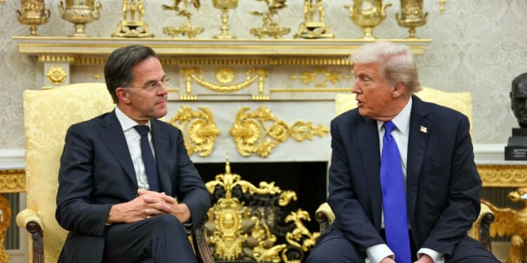 President Donald Trump talks to NATO Secretary General Mark Rutte during their meeting in the Oval Office of the White House in Washington, D.C., on Oct. 22, 2025.