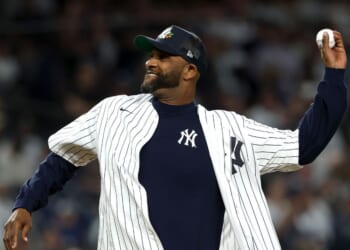 Former New York Yankee CC Sabathia throws the ceremonial first pitch before the game between the New York Yankees and the Toronto Blue Jays in game three of the American League Division Series at Yankee Stadium on Oct. 7, 2025, in the Bronx borough of New York City.