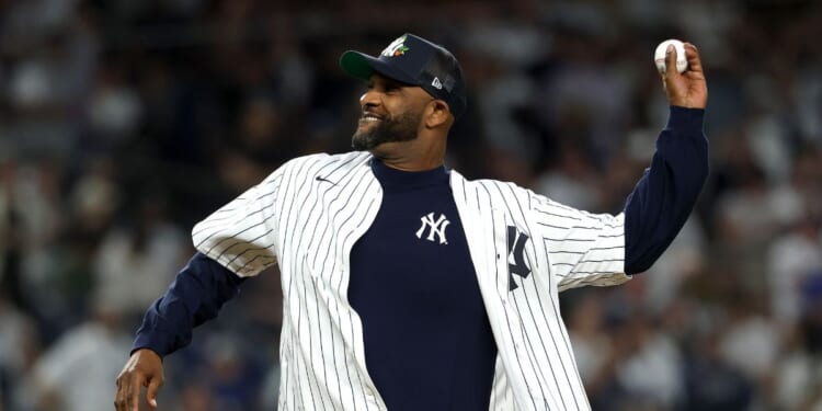 Former New York Yankee CC Sabathia throws the ceremonial first pitch before the game between the New York Yankees and the Toronto Blue Jays in game three of the American League Division Series at Yankee Stadium on Oct. 7, 2025, in the Bronx borough of New York City.