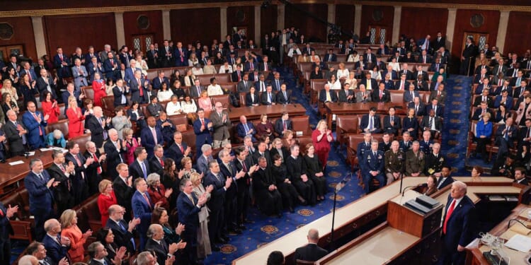 Republican members of Congress applaud President Donald Trump Tuesday during his State of the Union address during a joint session of Congress at the U.S. Capitol in Washington, D.C.