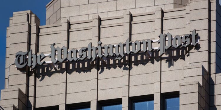 The logo of The Washington Post is displayed on the top of the organization's editorial headquarters in Washington, DC on May 26, 2025.