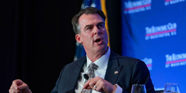 Oklahoma Gov. Kevin Stitt is interviewed by David Rubenstein alongside Maryland Gov. Wes Moore at the Economic Club on Feb. 18, 2026, in Washington, D.C.