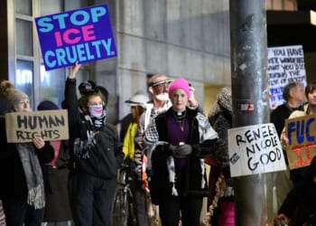Anti-ICE activists display signs during a protest at the U.S. Immigration and Customs Enforcement facility on Jan. 9, 2026, in Portland, Oregon.