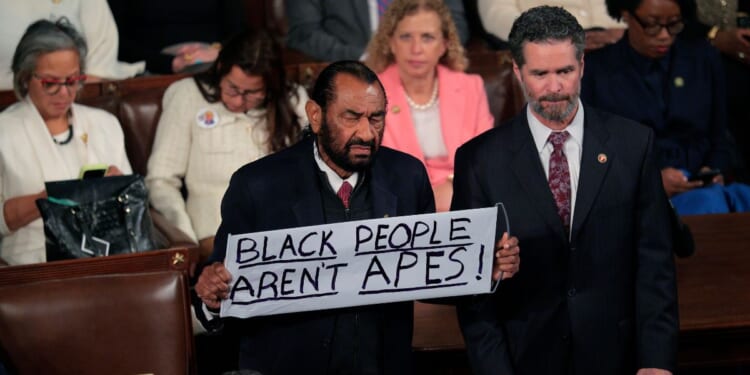 Rep. Al Green, a Democrat from Texas, holds up a sign as Trump delivers his State of the Union address during a joint session of Congress at the U.S. Capitol on Feb. 24, 2026, in Washington, D.C.
