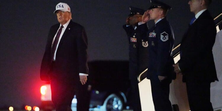 President Donald Trump deplanes from Air Force One at Palm Beach International Airport in West Palm Beach, Florida on Friday.