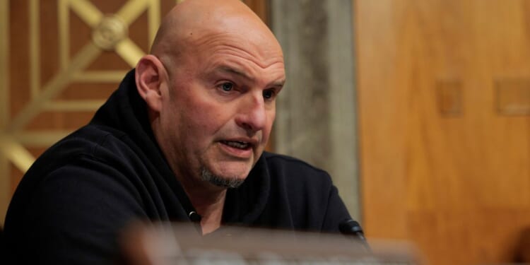 Sen. John Fetterman (D-PA) speaks during a confirmation hearing in the Dirksen Senate Office Building in Washington, DC on March 18, 2026.