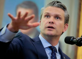 Secretary of War Pete Hegseth answers questions in the Oval Office at the White House on March 24, 2026, in Washington, D.C.