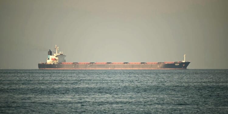 A cargo ship is pictured off the coastal city of Fujairah, in the Strait of Hormuz in the northern Emirate on Feb. 25, 2026.