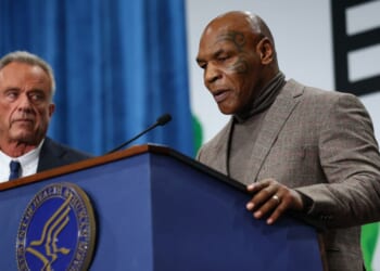 Mike Tyson speaks next to U.S. Secretary of Health and Human Services Robert F. Kennedy Jr. at an event in Washington, DC on Feb. 11, 2026.