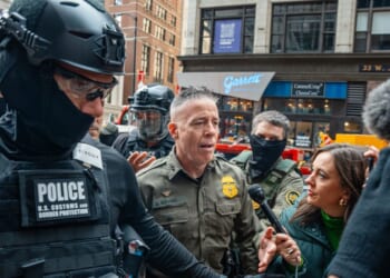 U.S. Border Patrol commander Gregory Bovino pushes through a crowd of media and protesters as he enters the Dirksen Federal Building on Oct. 28 in Chicago, Illinois, to meet with U.S. District Judge Sara Ellis. A federal appeals court last week ruled against what it called Ellis' "sweeping preliminary injunction" that attempted to regulate "all federal immigration enforcement efforts districtwide."