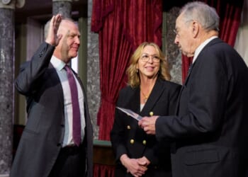 GOP Sen. Alan Armstrong of Oklahoma, accompanied by his wife Shelly, participates in a ceremonial swearing in ceremony Tuesday with Senate President Pro Tempore Charles Grassley, an Iowa Republican, in the Old Senate Chamber at the U.S. Capitol Building in Washington, D.C. Armstrong, a longtime petroleum executive, was sworn in as an interim Senator for Oklahoma to replace Markwayne Mullin, who was tapped to replace Kristi Noem as the new secretary of homeland security.