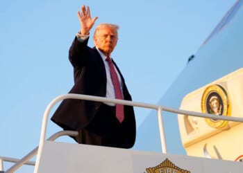 President Donald Trump departs Air Force One at Miami International Airport on Friday in Miami, Florida.