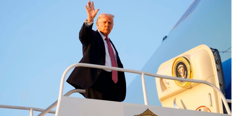President Donald Trump departs Air Force One at Miami International Airport on Friday in Miami, Florida.