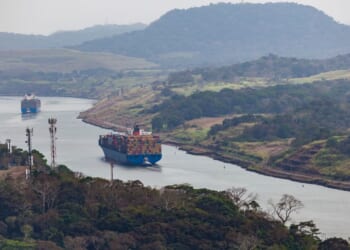 Cargo ships travel through the Panama Canal on March 26, 2019.